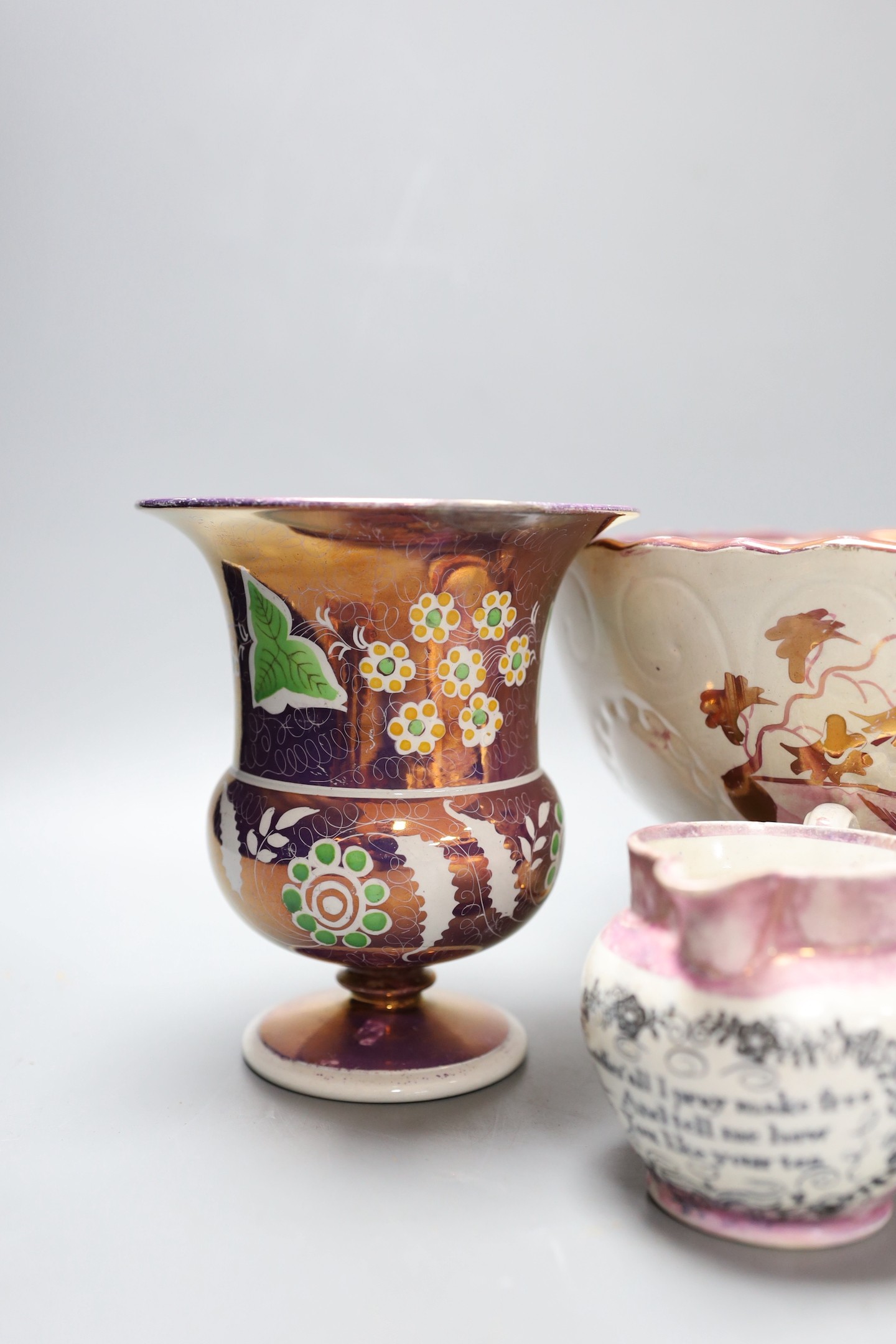 A group of early 19th century pink lustre vases and jugs and a junket bowl